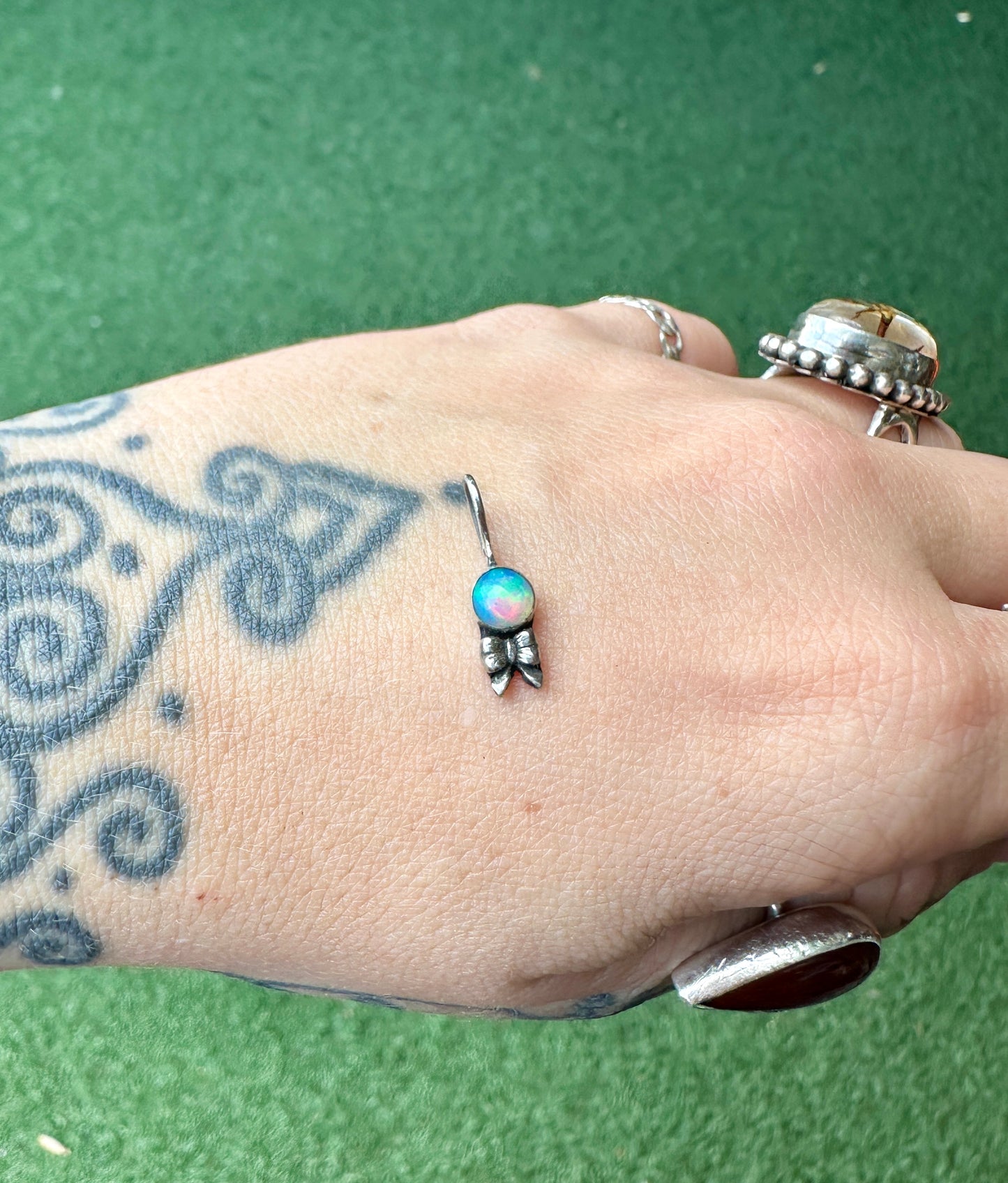 Opal bow charm