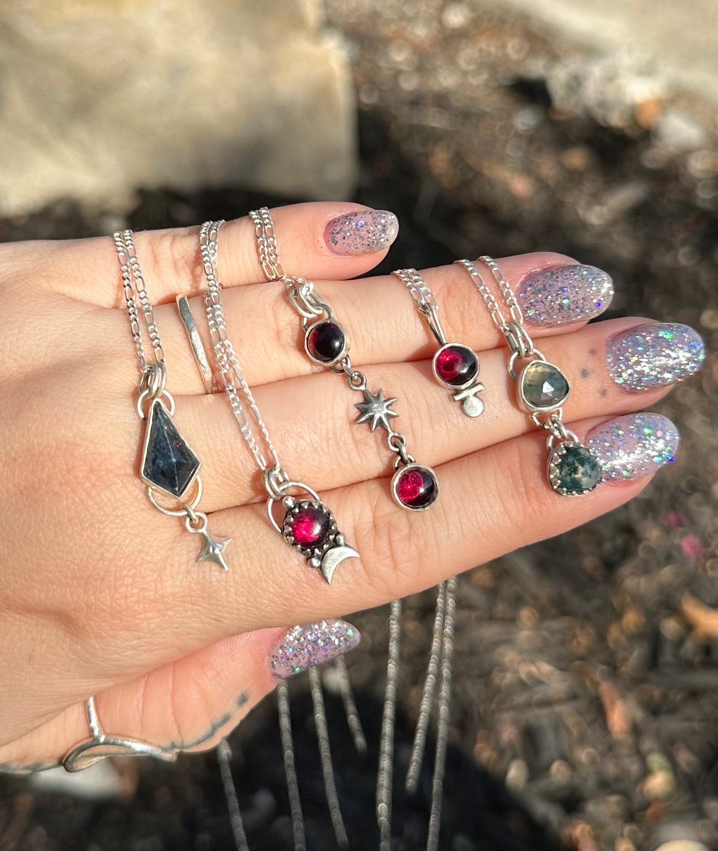 Garnets and star necklace .