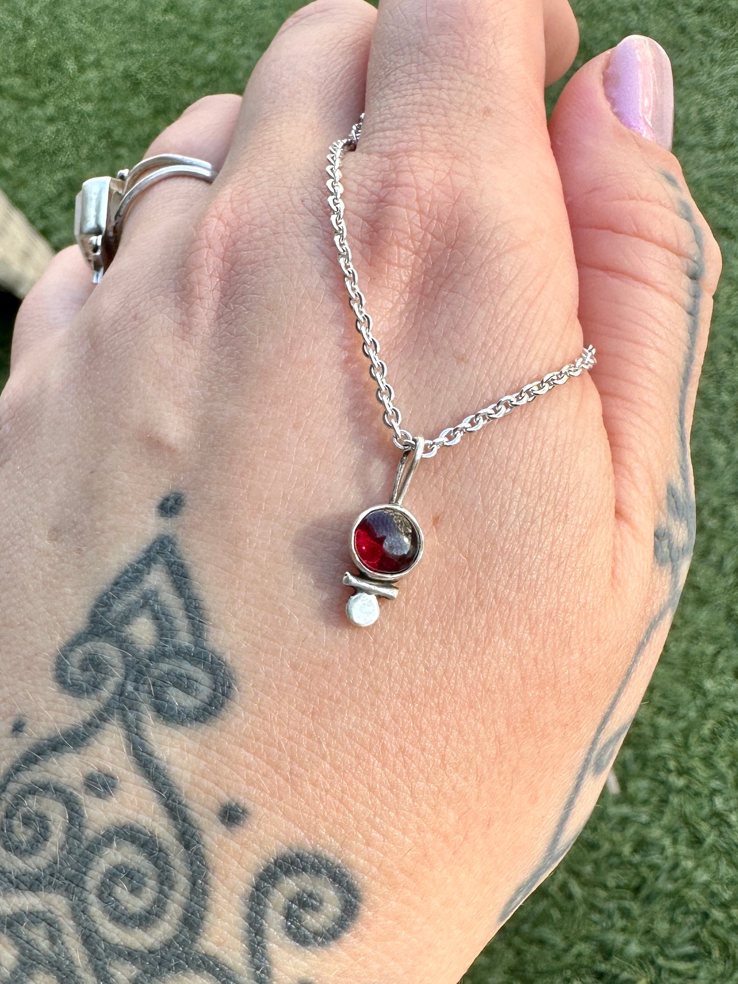 Dainty garnet droplet