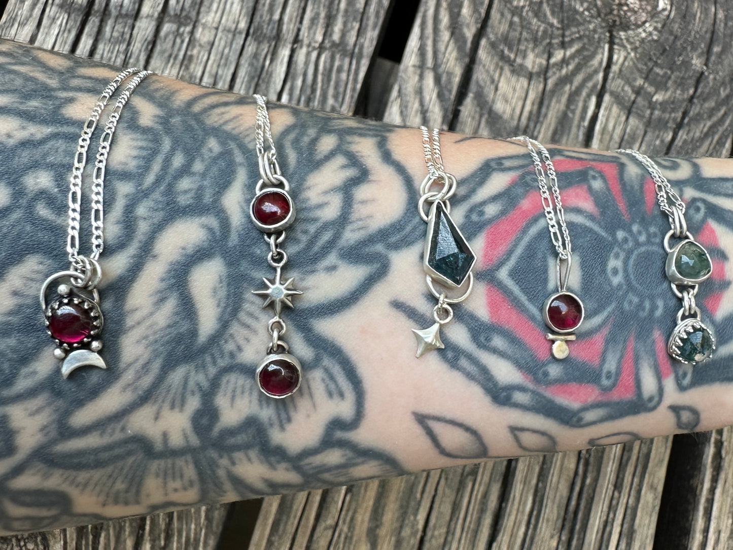 Garnets and star necklace .