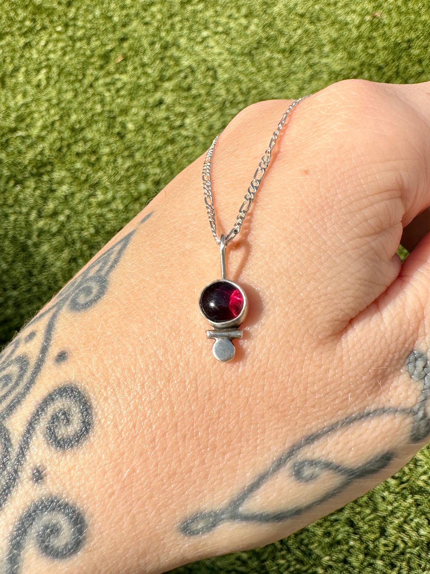 Dainty garnet droplet