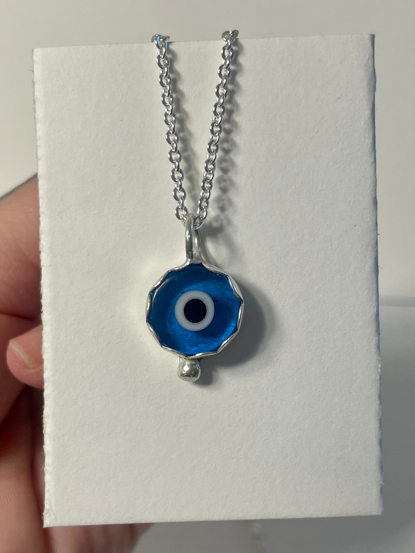 Scalloped evil eye